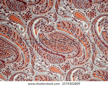 Assorted paisley patterns in brown and orange colours 