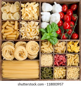 Assorted pastas in wooden box with cooking ingredients - Powered by Shutterstock