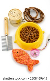 Assorted pet food, toys and accessories on white background. Quality nutrition, care and fun for little furry friends.