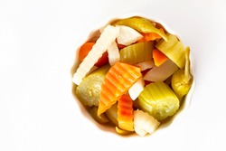 Assorted Pickles Vegetables Carrot, Chili, Radish In White Ceramic Bowl. Top View. Isolated. Copy Space. Top View.