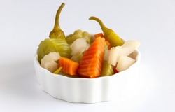 Assorted Pickles Vegetables Carrot, Chili, Radish In White Ceramic Bowl. Top View. Isolated. Copy Space. Isolate White Background.