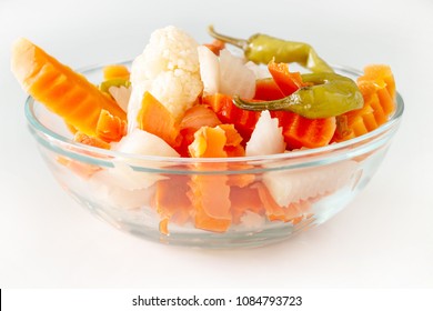 Assorted pickles vegetables carrot, chili, cauliflower in glass bowl. Top view. Isolated. Copy space.