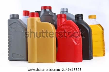 Assorted Plastic Containers for Engine oils on White Background