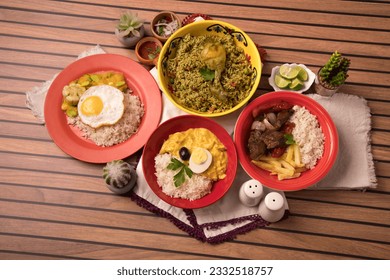 Assorted plates dishes aji de gallina arroz con pollo lomo saltado Peru peruvian traditional buffet table gourmet food