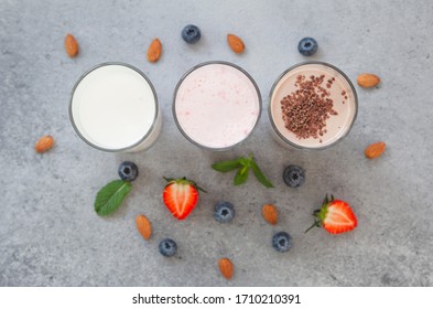 Assorted Protein Cocktails With Fresh Fruits, Berries And Chocolate. Protein Shake. Sports Nutrition And Healthy Lifestyle Concept. Top View.  