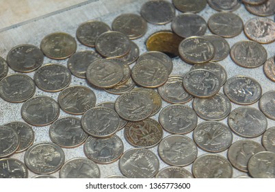 Assorted Quarters In A Coin Pusher Machine