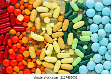 Assorted rainbow colorful tablets, pills, drugs background. Medication and healthcare concept. Close up, top view - Shutterstock ID 2117485031