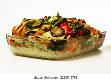 Assorted Raw Vegetables Cut In A Glass Deck For Baking In The Oven. Vegetarian Food Preparation