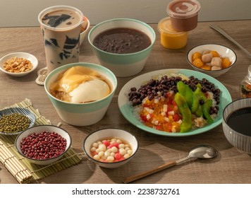 assorted Red Bean Rice Balls, Taro Balls, bean curd, brown sugar shaved ice, Grass Jelly Iced Milk Tea, burn jelly, egg and chocolate pudding served in dish isolated on table top view of taiwan food - Shutterstock ID 2238732761