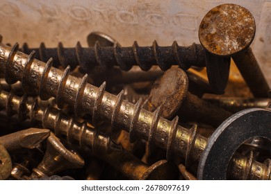 Assorted Rusty and Shiny Screws in a Toolbox
Description: A macro photograph of various screws and fasteners, mixing shiny golden tones with rusted, weathered pieces. The image combines both functiona