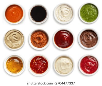 Assorted sauces in ramekin top view set and collection isolated on white background. BBQ sauce, garlic sauce, mayonnaise, guacamole, ketchup, salsa, ranch, mustard, buffalo. Dips set assorted set.