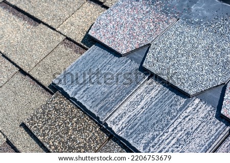 Assorted selection of premium synthetic roof shingles to pick a new style.