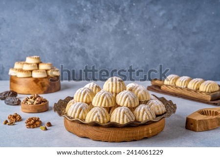 Assorted semolina maamoul or mamoul cookies with dates , walnuts and pistachio nuts. Traditional arabic Eid al Adha, Eid al Fitr sweets