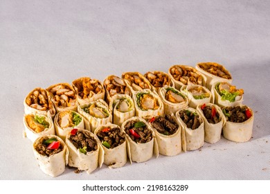assorted shawarma platter, doner kabab wraps family deal side view isolated on grey background turkish fastfood