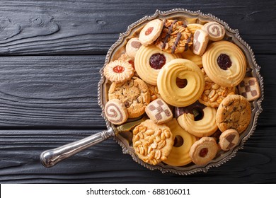 Assorted shortbread cookie close-up on a plate on a table. vertical view from above
 - Powered by Shutterstock