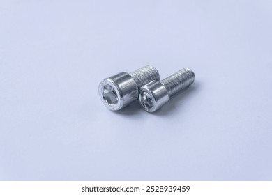 Assorted Silver Hex Socket Cap Screws on White Background
