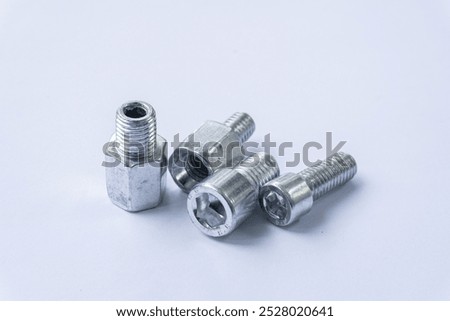 Assorted Silver Hex Socket Cap Screws on White Background