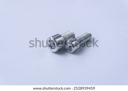 Assorted Silver Hex Socket Cap Screws on White Background