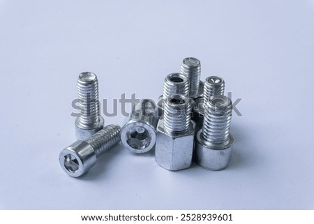 Assorted Silver Hex Socket Cap Screws on White Background
