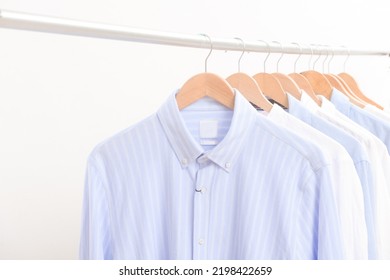 Assorted Striped ,white Dress Shirts Hanging On Hangers