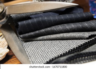 Assorted Suit Fabric Folded Between Large Scissors