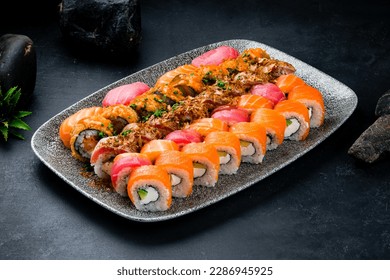 Assorted sushi nigiri and maki big set. A variety of Japanese sushi with tuna, salmon, eel. Assorted Japanese sushi rolls with salmon, tuna, shrimp, eel, avocado, cream cheese and cucumber. - Powered by Shutterstock