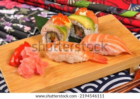 Assorted sushi nigiri and maki set on slate. A variety of Japanese sushi with tuna, crab, salmon, eel and rolls. Top view, japanese food，Sushi platter
