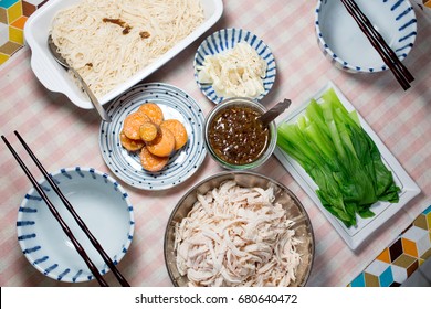 Assorted Taiwanese homecooking food set.Top view.Homemade dinner for family.Boiled vegetables.Sweet potatoes.Bamboo shoot salad.Vermicelli.Shredded chicken.