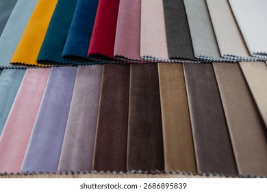 Assorted textile fabric samples in multiple colors arranged for furniture and decoration projects