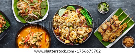 assorted thai food with shrimp pad thai and panang curry