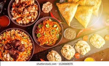 Assorted Uzbek Food Set, Pilaf, Samsa, Lagman, Manta And Korean Carrots, Uzbek Restaurant Concept, Uzbek Food Feast. Festive, Homemade Lunch, Dinner For The Whole Family. Copy Space, Top View