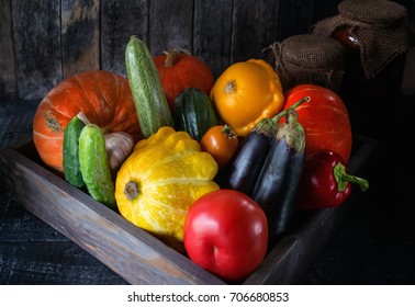 Assorted Vegetables, Pumpkin, Zucchini, Eggplant, Garlic, Green Onions, And Tomatoes On A Wooden Background In Rustic Style For Thanksgiving. The Horizontal Fram