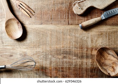 Assorted Wooden Kitchen Utensils On A Rustic Wooden Surface. Flatlay. Copy Space