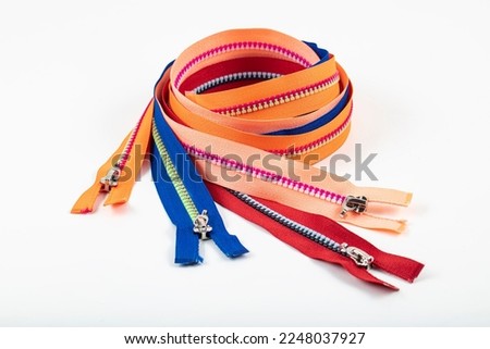 Assorted YKK Nylon Zippers. The Hottest Colors of The Season-Great for Sewing Craft Projects. Bright zipper of different colors and variants in the textile industry.
