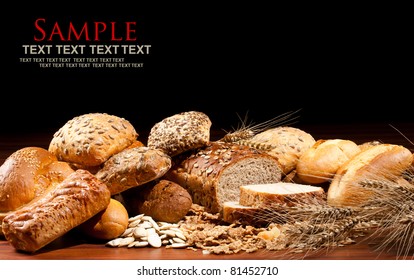 Assortment of baked goods in black background - Powered by Shutterstock