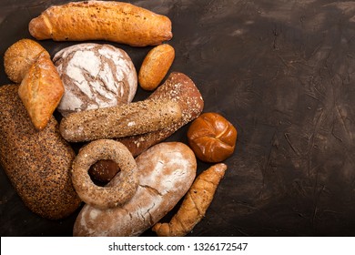 Assortment Of Baked Goods On Dark Table With Free Copy Space For Text. Top View, From Above, Flat Lay.