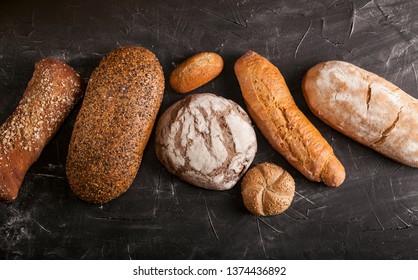 Assortment Of Baked Goods On Dark Table With Free Copy Space For Text. Top View, From Above, Flat Lay.