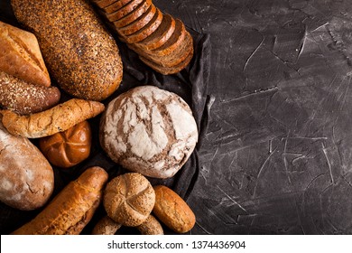 Assortment Of Baked Goods On Dark Table With Free Copy Space For Text. Top View, From Above, Flat Lay.