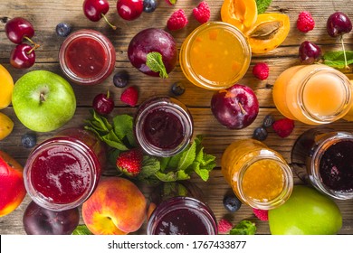 Assortment of berries and fruits jams. Set of various seasonal summer berry and fruit jam, marmalade and confitures. Wooden rustic background copy space - Shutterstock ID 1767433877