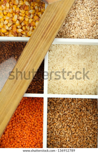 Assortment of\
cereals in white wooden box close\
up