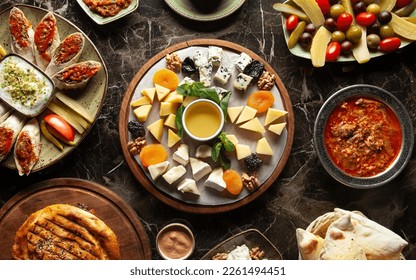 Assortment of cheeses, olives, Turkish snacks. Turkish breakfast - Shutterstock ID 2261494451