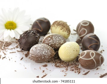 Assortment Of Chocolate Eggs On White Background