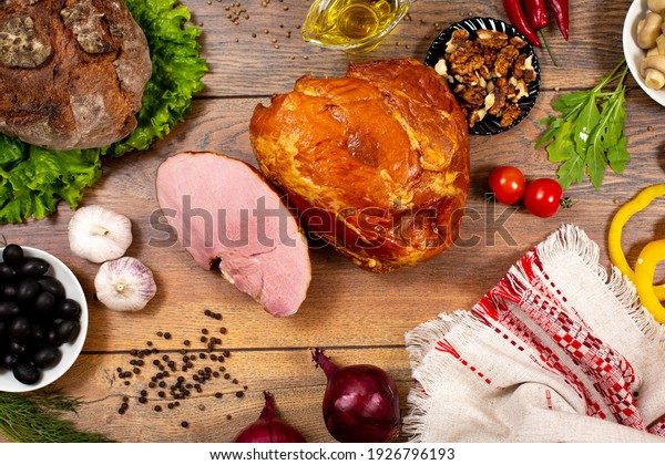 Assortment of cold cuts, a variety of
processed cold meat products. On a wooden
background