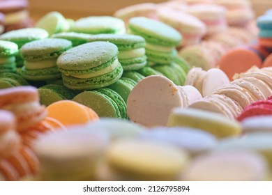 Assortment Of Colorful French Macaroons On Cafe Showcase For Sale . Variety Of Macaron Flavours. Sweet Almond Cakes In Store. Cookies In The Shop On Storefront