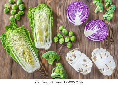 Assortment Of Different Cruciferous Vegetables On The Wooden Background