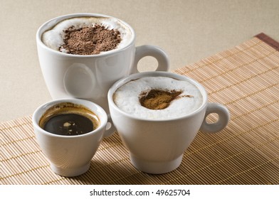 Assortment of different tasty hot coffee drinks - espresso, cappuccino, mochaccino