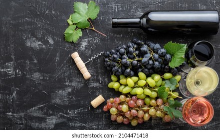 Assortment Different Types Of Wine And Grade Varieties. Tasting White Rose Red Wine In Glasses Near White Pink And Black Grapes, Red Wine Bottle On Dark Concrete Background. Long Web Banner