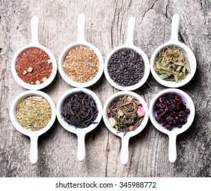 assortment of dry tea on wooden background - Powered by Shutterstock