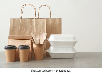 Assortment of food delivery containers on table - Shutterstock ID 1452163529