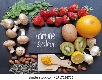 Assortment Of Food To Naturally Boost Immune System. Healthy Eating For Strong Immune System. Immune-boosting Foods. Concept Of Helpful Ways To Strengthen Immunity Naturally. Kiwi, Turmeric, Garlic...